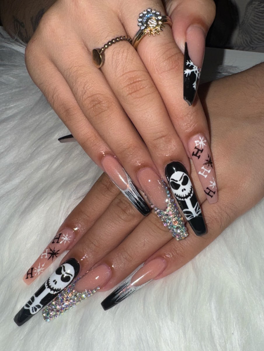 Stiletto nails with rhinestone detail